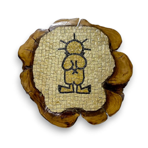 Pal-Mosaic Handala mosaic decor featuring black and beige tiles on natural wood slab background