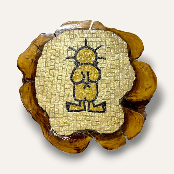 Pal-Mosaic Handala mosaic decor featuring black and beige tiles on natural wood slab background