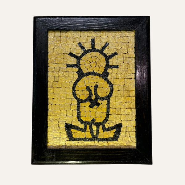 Handmade Palestinian Handala mosaic art with black and yellow tiles in a black wooden frame by Pal-Mosaic