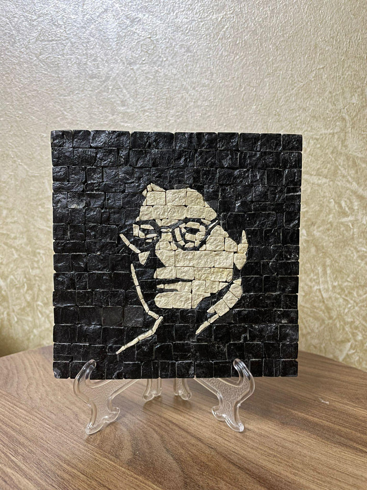 Pal-Mosaic Mahmoud Darwish mosaic art featuring black and white portrait tiles displayed on a clear stand