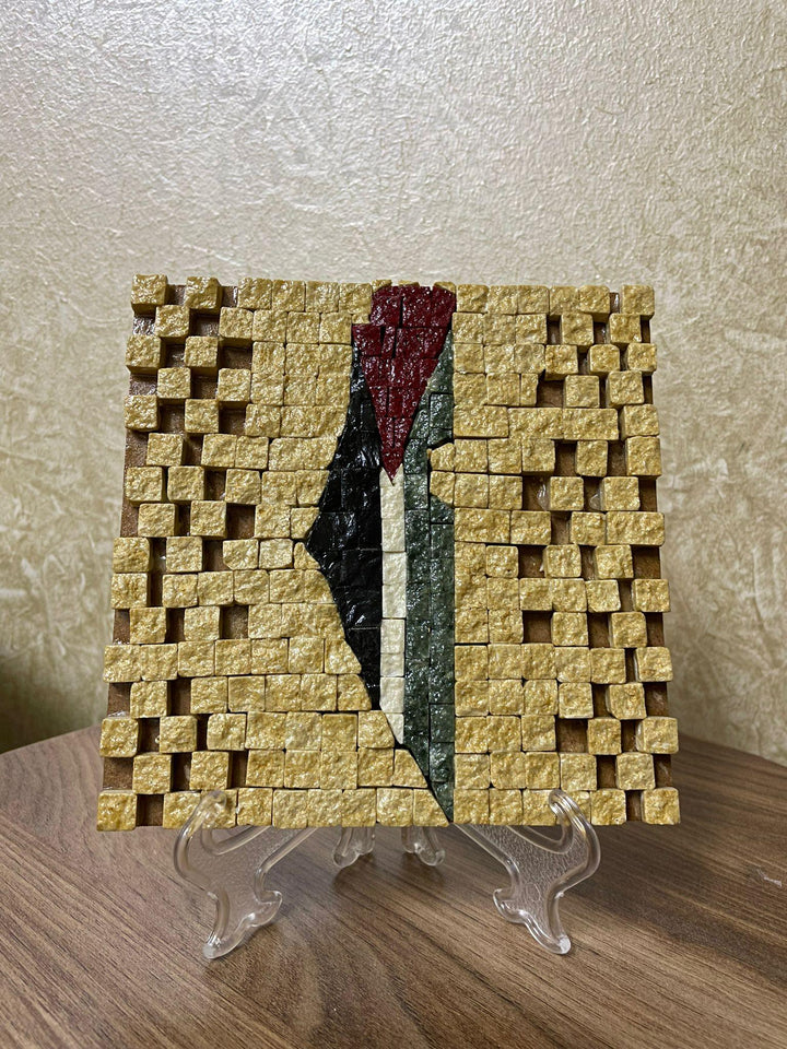 Pal-Mosaic Palestine flag mosaic art with raised golden tiles and colorful geometric design on display stand