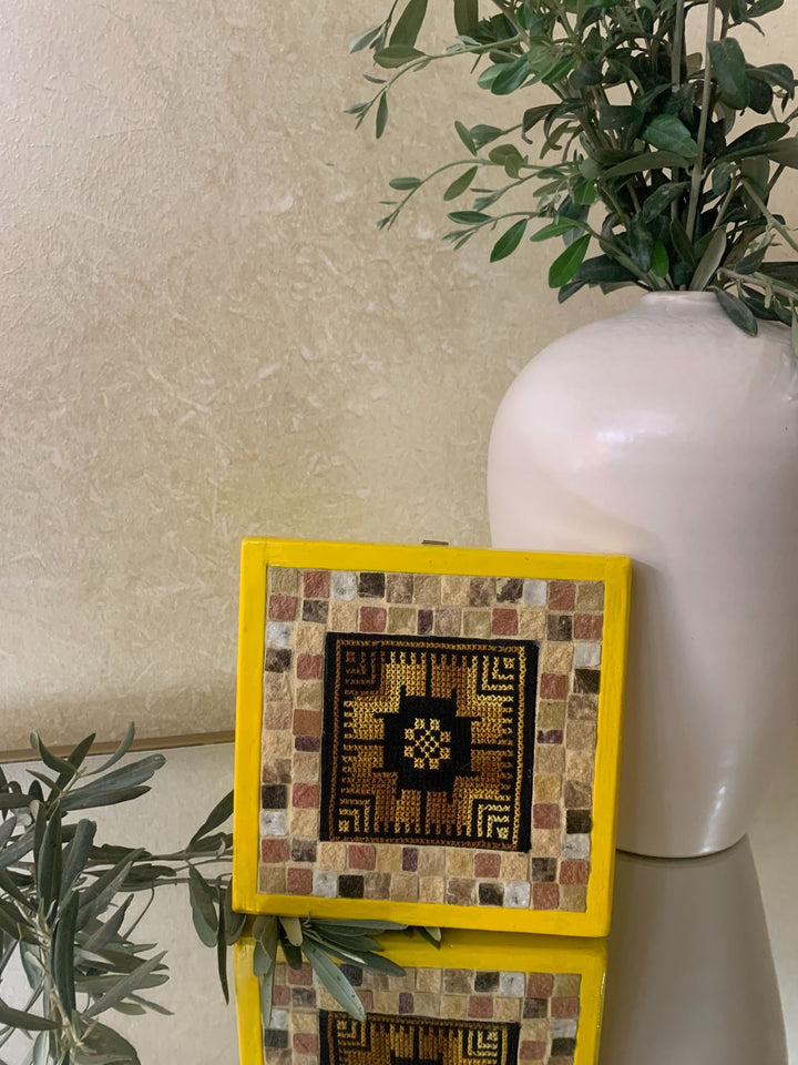 Pal-Mosaic yellow framed mosaic and embroidery piece featuring cultural Palestinian decor design